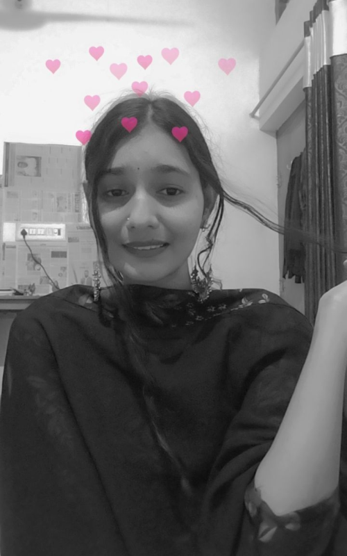 This may contain_ a woman with pink hearts on her hair